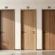 Typical door width comparison showing 28 inch, 32 inch, and 36 inch standard interior and exterior door sizes in a modern home hallway